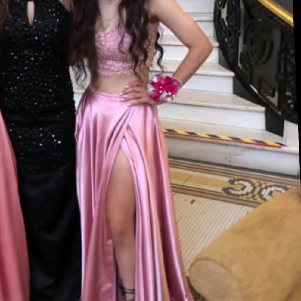 2 piece prom dress. Has padding. Tie back of the top. Adjust top to your size